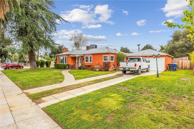 single story home featuring fence, stucco siding, a chimney, a front lawn, and concrete driveway