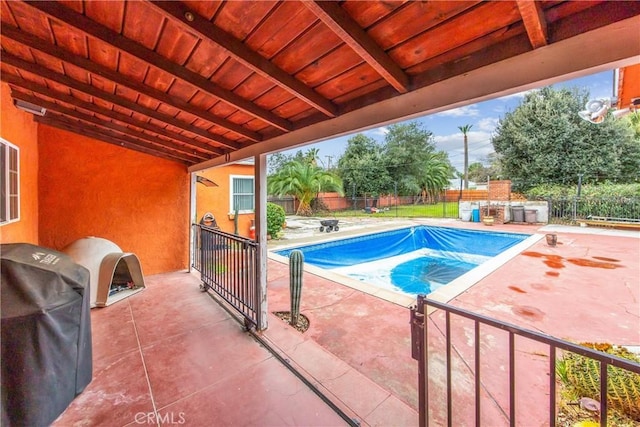 view of swimming pool with a fenced in pool, a grill, a fenced backyard, and a patio area