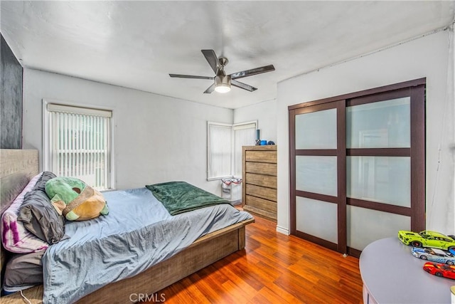 bedroom featuring ceiling fan and wood finished floors