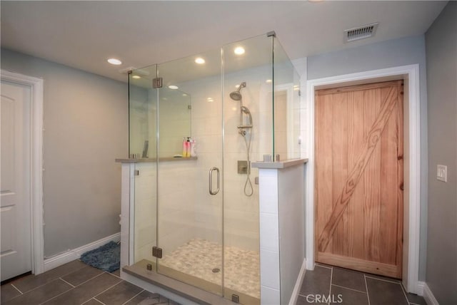 full bathroom with a stall shower, tile patterned flooring, baseboards, visible vents, and recessed lighting