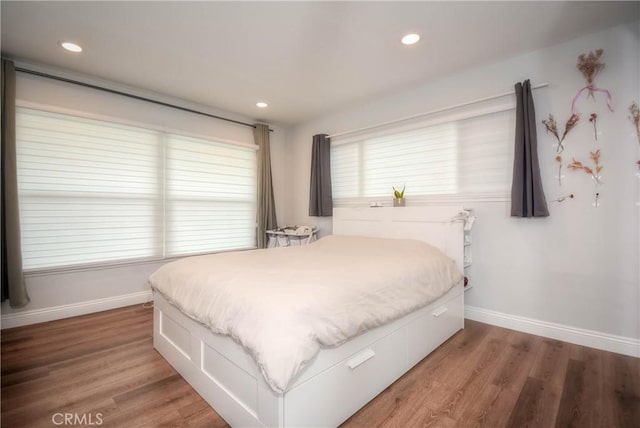 bedroom featuring baseboards, recessed lighting, and light wood-style floors