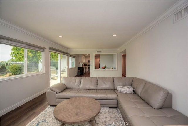 living room with crown molding, recessed lighting, baseboards, visible vents, and wood finished floors