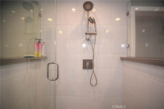 full bath with a shower stall