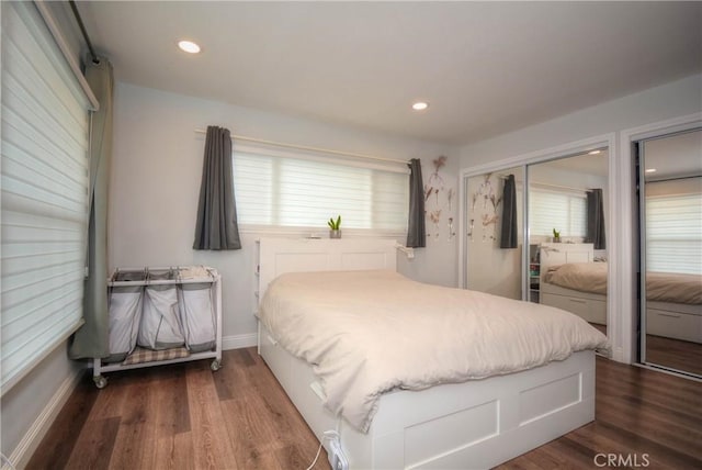 bedroom featuring dark wood-type flooring, baseboards, and recessed lighting