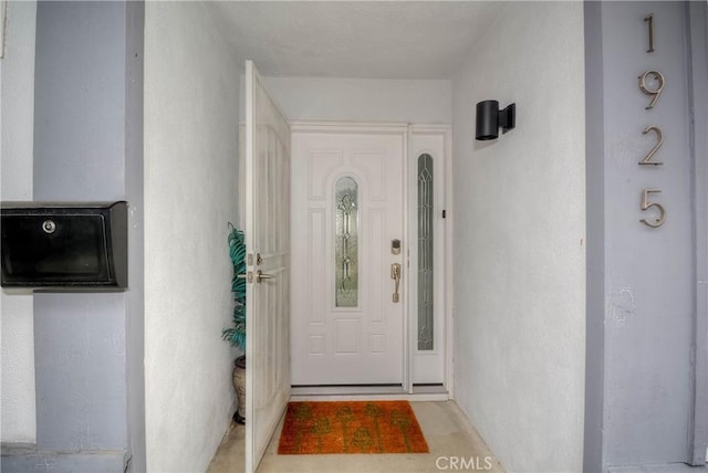 doorway to property with stucco siding