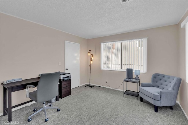 office area featuring baseboards, carpet floors, and a textured ceiling