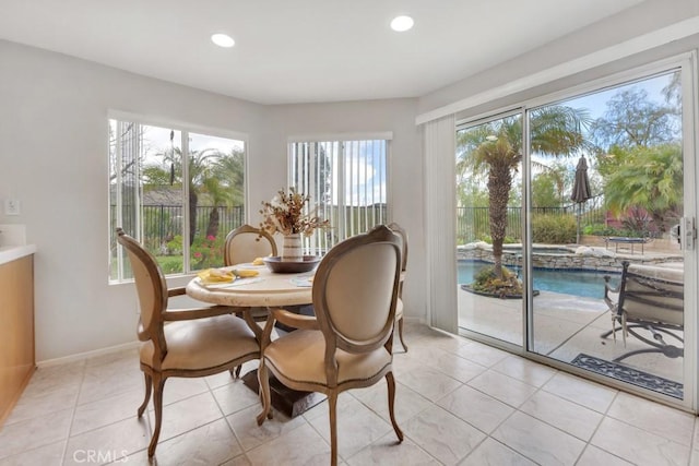 dining space with light tile patterned floors, recessed lighting, and baseboards