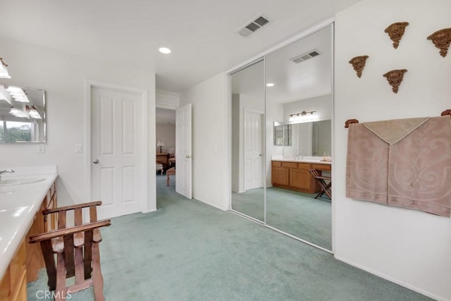 bathroom with visible vents, baseboards, and vanity