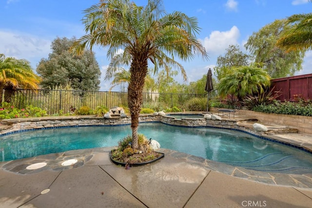 view of swimming pool with an in ground hot tub, a fenced backyard, a fenced in pool, and a patio