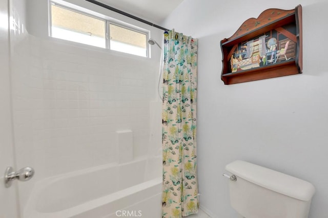 full bath featuring shower / bath combo with shower curtain and toilet