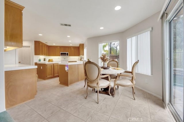 dining room with recessed lighting, visible vents, baseboards, and light tile patterned floors