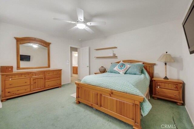 bedroom featuring light colored carpet and ceiling fan