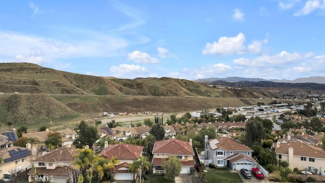 aerial view featuring a mountain view and a residential view