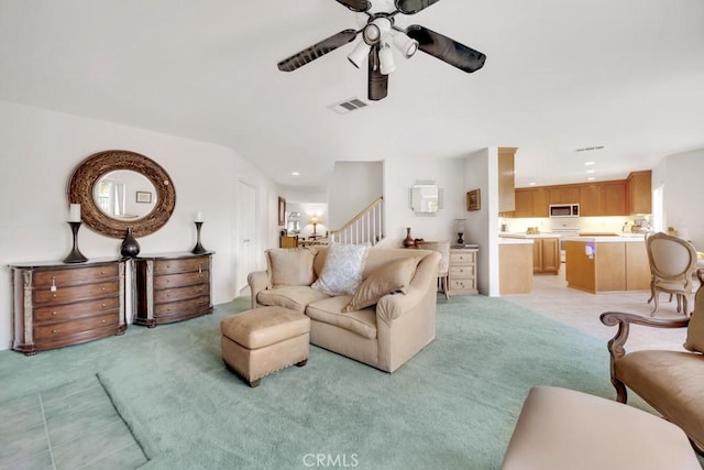 living area with recessed lighting, light colored carpet, visible vents, and ceiling fan