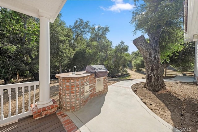 view of patio / terrace with area for grilling and a grill