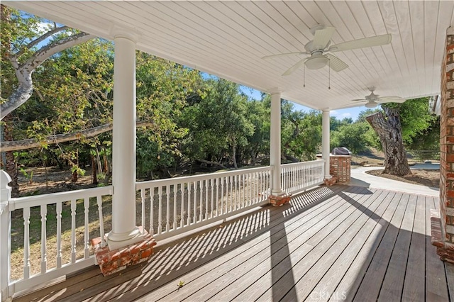 wooden terrace with a ceiling fan