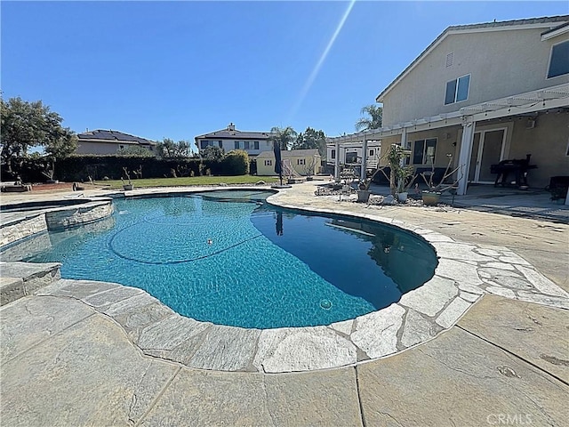 pool with a patio area