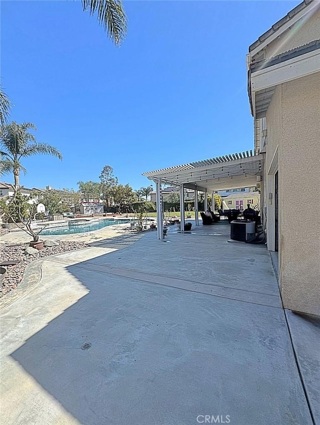 view of patio / terrace featuring a pergola and a community pool