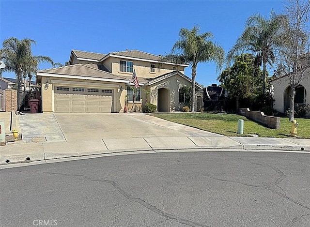 traditional-style house featuring a front lawn, a tile roof, concrete driveway, stucco siding, and an attached garage