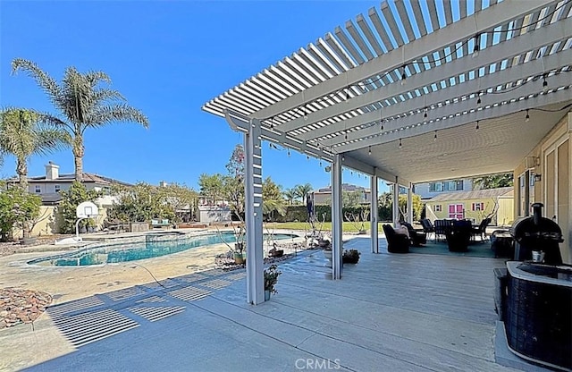 view of patio with a community pool, fence, and a pergola