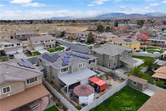 bird's eye view featuring a mountain view and a residential view