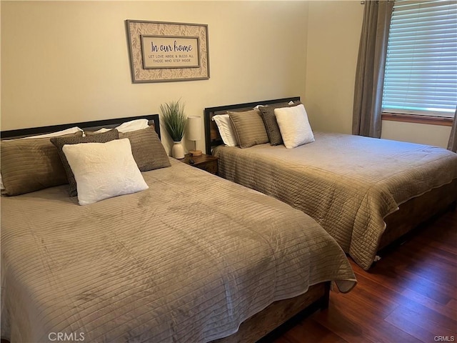 bedroom with wood finished floors