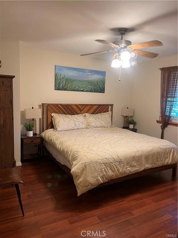 bedroom featuring ceiling fan and wood finished floors