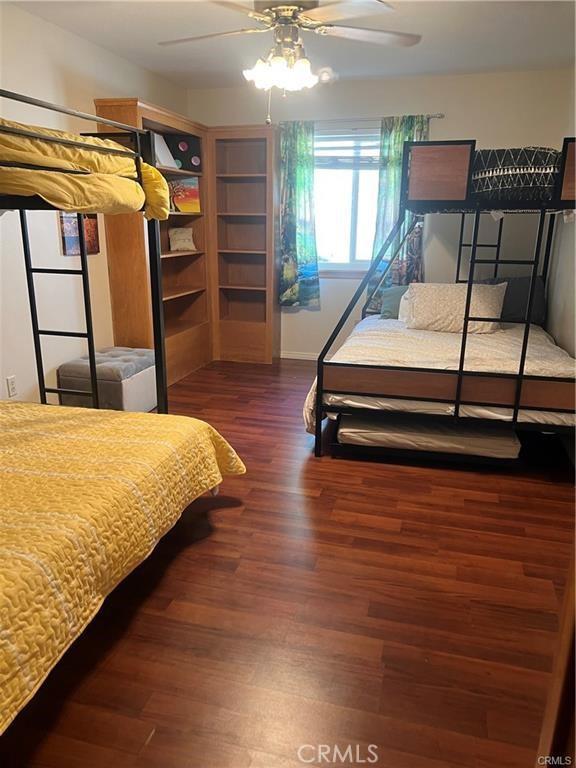 bedroom with wood finished floors