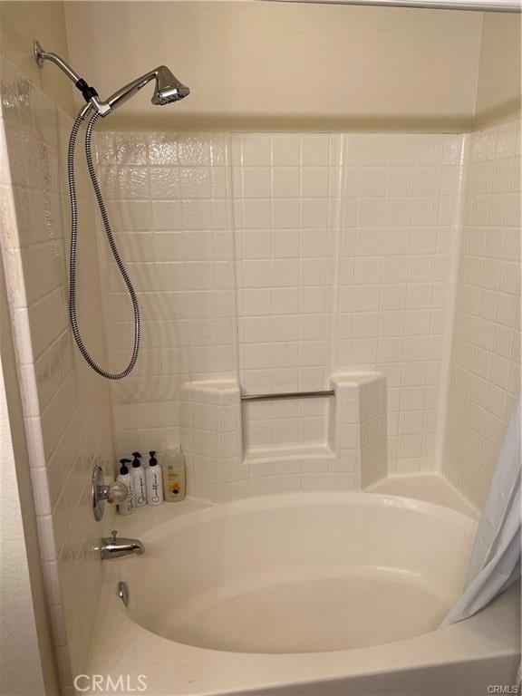 bathroom featuring shower / bath combination with curtain