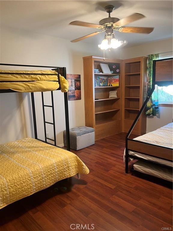 bedroom featuring ceiling fan and wood finished floors