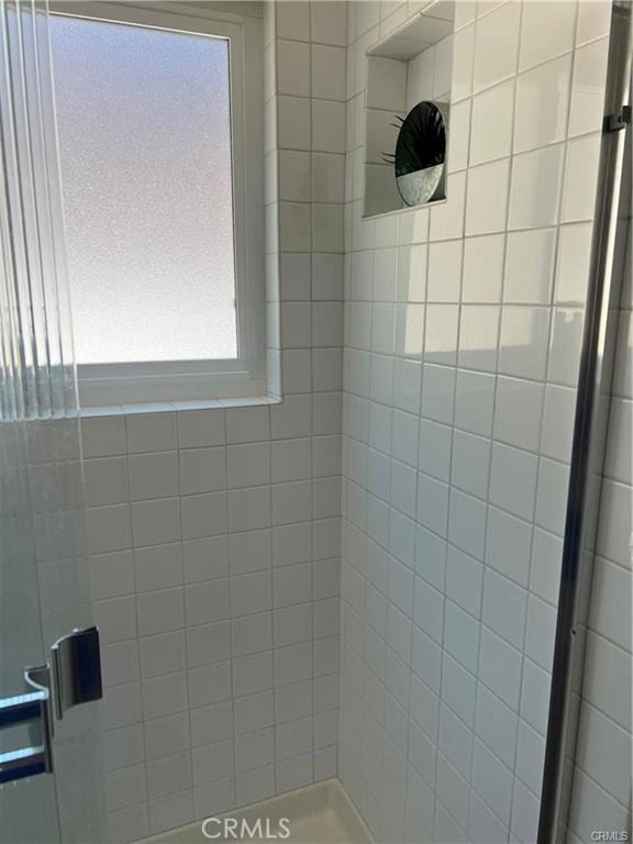 bathroom featuring a stall shower