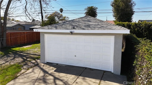 garage with fence