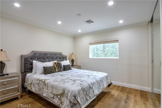 68340 Verano Rd, Cathedral City, CA 92234 - bedroom featuring baseboards, wood finished floors, visible vents, and ornamental molding