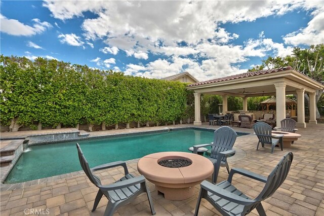 68340 Verano Rd, Cathedral City, CA 92234 - view of swimming pool featuring a fenced in pool, an outdoor fire pit, a gazebo, a fenced backyard, and a patio