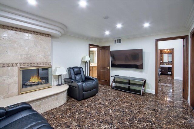 68340 Verano Rd, Cathedral City, CA 92234 - living area featuring baseboards, visible vents, recessed lighting, a tiled fireplace, and crown molding