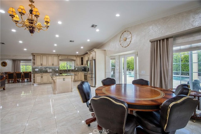 68340 Verano Rd, Cathedral City, CA 92234 - dining room with visible vents, a healthy amount of sunlight, ornamental molding, and a chandelier