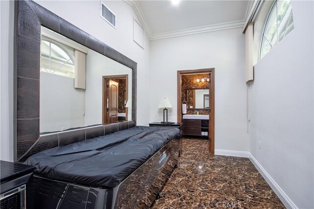 68340 Verano Rd, Cathedral City, CA 92234 - bedroom with visible vents, marble finish floor, ensuite bathroom, crown molding, and baseboards