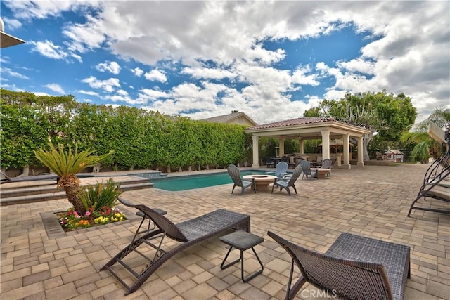68340 Verano Rd, Cathedral City, CA 92234 - view of patio with a gazebo, an outdoor pool, and an outdoor fire pit