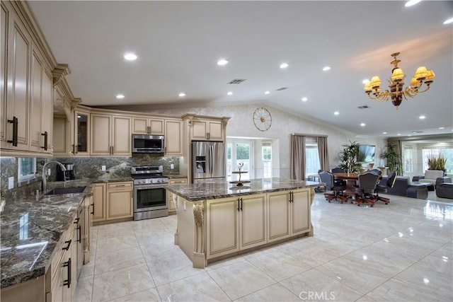 68340 Verano Rd, Cathedral City, CA 92234 - kitchen featuring a sink, lofted ceiling, cream cabinetry, and stainless steel appliances