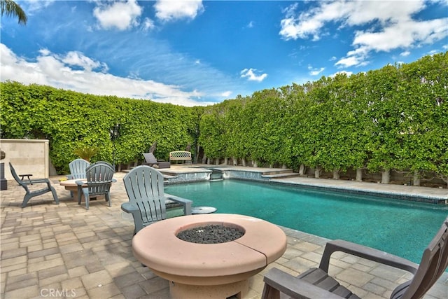 68340 Verano Rd, Cathedral City, CA 92234 - view of swimming pool with a fenced in pool, an outdoor fire pit, a fenced backyard, and a patio area