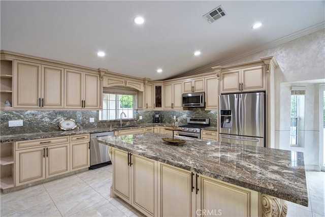 68340 Verano Rd, Cathedral City, CA 92234 - kitchen with visible vents, open shelves, cream cabinets, stainless steel appliances, and a sink