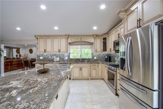 68340 Verano Rd, Cathedral City, CA 92234 - kitchen featuring a sink, cream cabinetry, tasteful backsplash, and stainless steel appliances