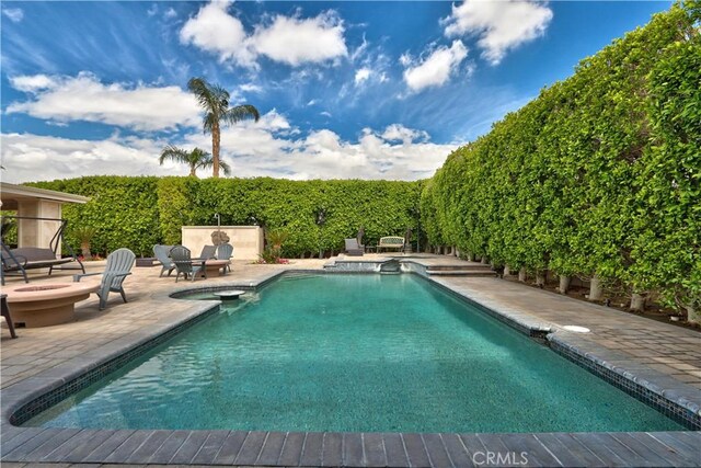 68340 Verano Rd, Cathedral City, CA 92234 - view of pool with a fenced in pool, a patio, and a fire pit