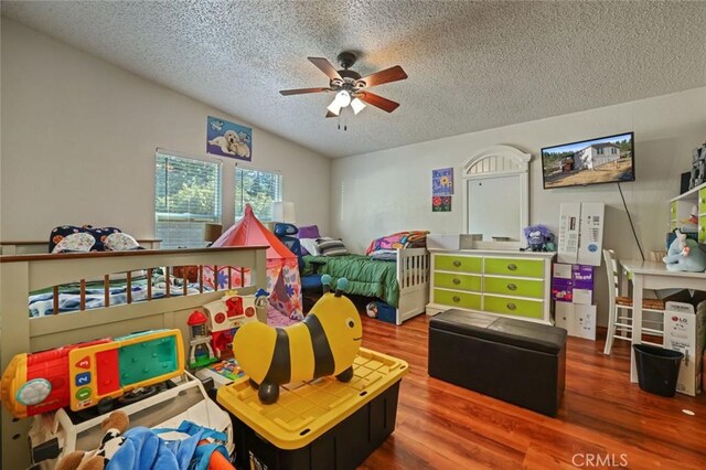 22292 N Tuolumne Rd, Twain Harte, CA 95383 - bedroom featuring ceiling fan, a textured ceiling, lofted ceiling, and wood finished floors