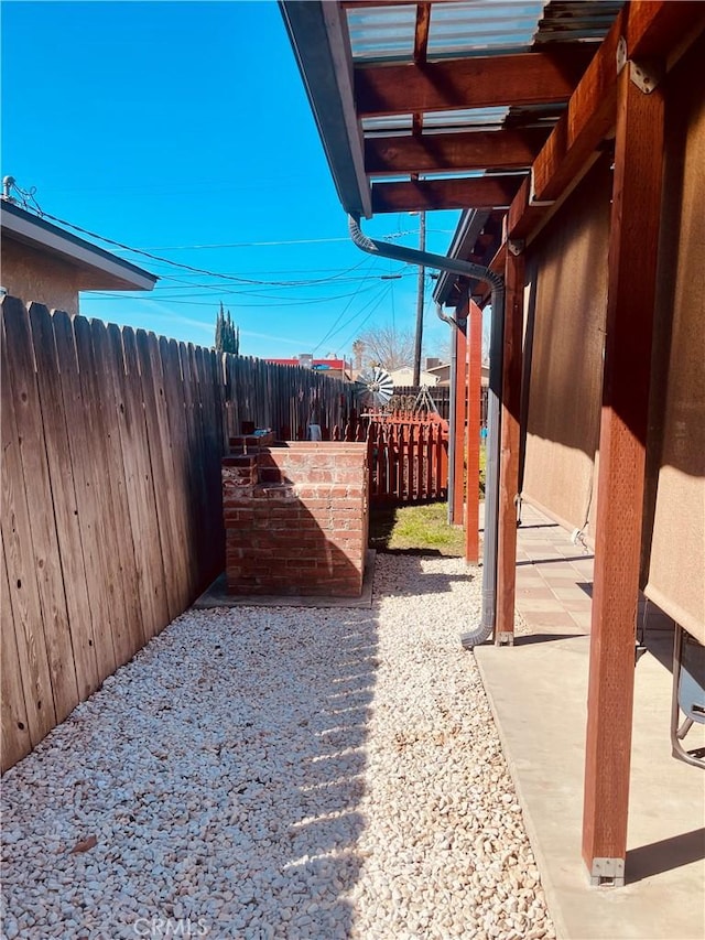 view of yard with a patio area and a fenced backyard