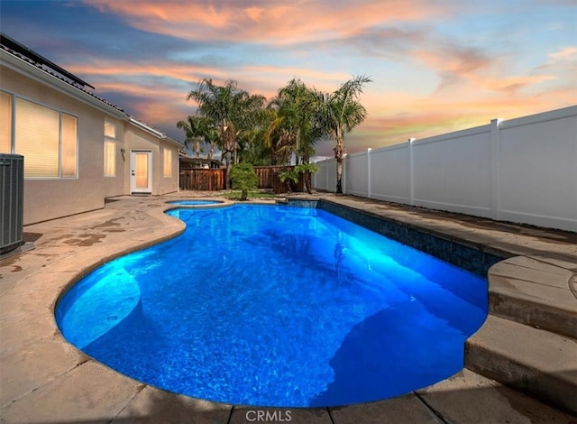 view of swimming pool featuring central air condition unit, a fenced backyard, a fenced in pool, an in ground hot tub, and a patio area