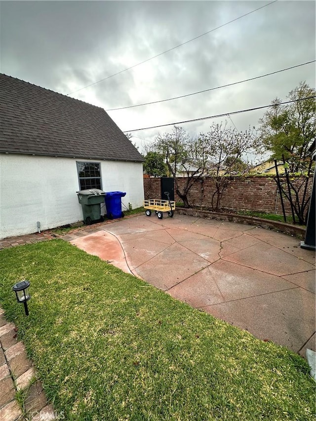 view of patio / terrace featuring fence