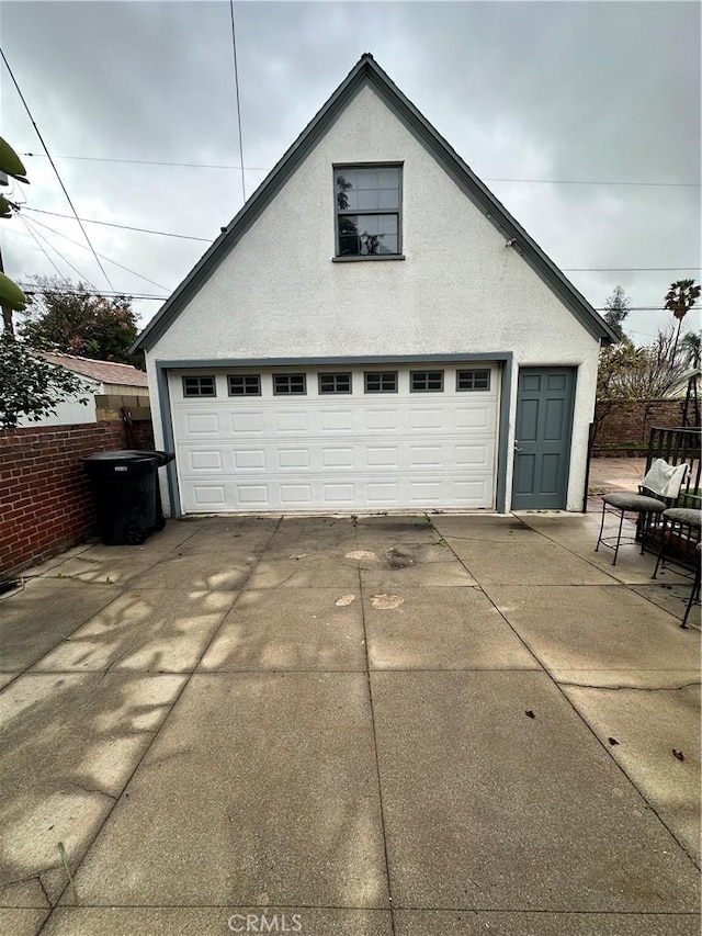 detached garage with fence