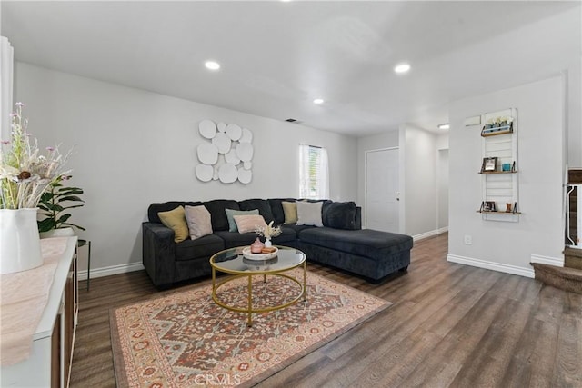 living room with baseboards, dark wood-style flooring, visible vents, and recessed lighting