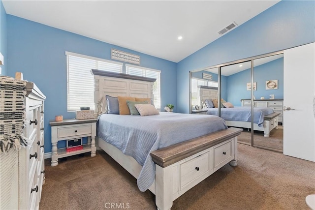 bedroom with vaulted ceiling, a closet, visible vents, dark carpet, and recessed lighting